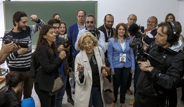 Carmena, local candidate of Ahora Madrid (Now Madrid), gestures after casting her vote at a polling station during regional and municipal elections in Madrid