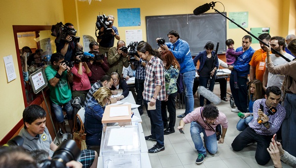 Podemos (We Can) leader Iglesias votes at a polling station during regional and municipal elections in Madrid