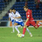 Un par de lances del partido entre el CD Tenerife y el Sporting de Gijón. | FRAN PALLERO
