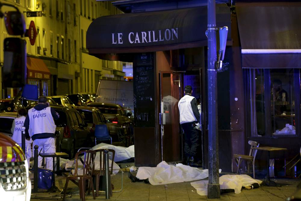 General view of the scene that shows the covered bodies outside a restaurant following a shooting incident in Paris