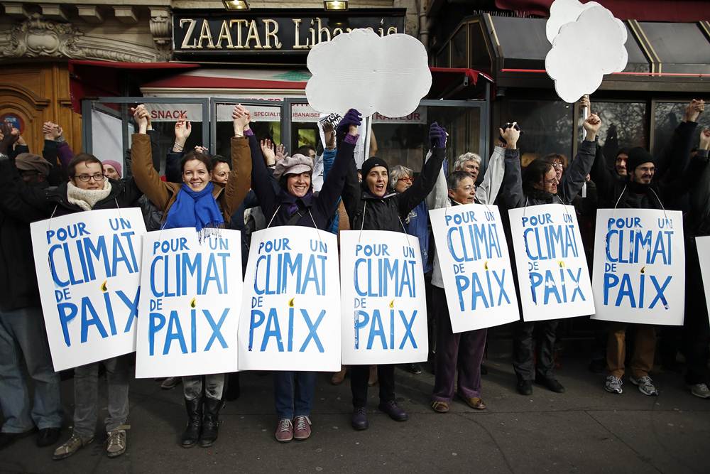 People form a human chain to show solidarity for climate change after the cancellation of a planned climate march ahead of the World Climate Change Conference 2015 in Paris