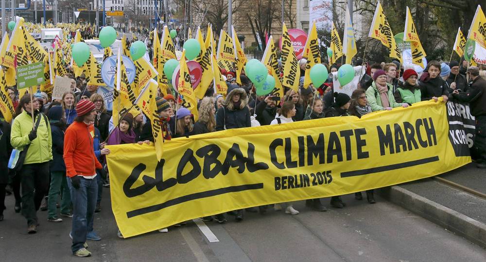 People demonstrate during protest march in Berlin ahead of COP21 summit