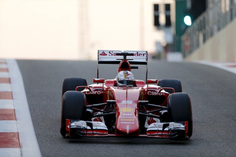 Ferrari Formula One driver Sebastian Vettel of Germany leaves the pit lane during qualifying session of Abu Dhabi F1 Grand Prix at the Yas Marina circuit in Abu Dhabi