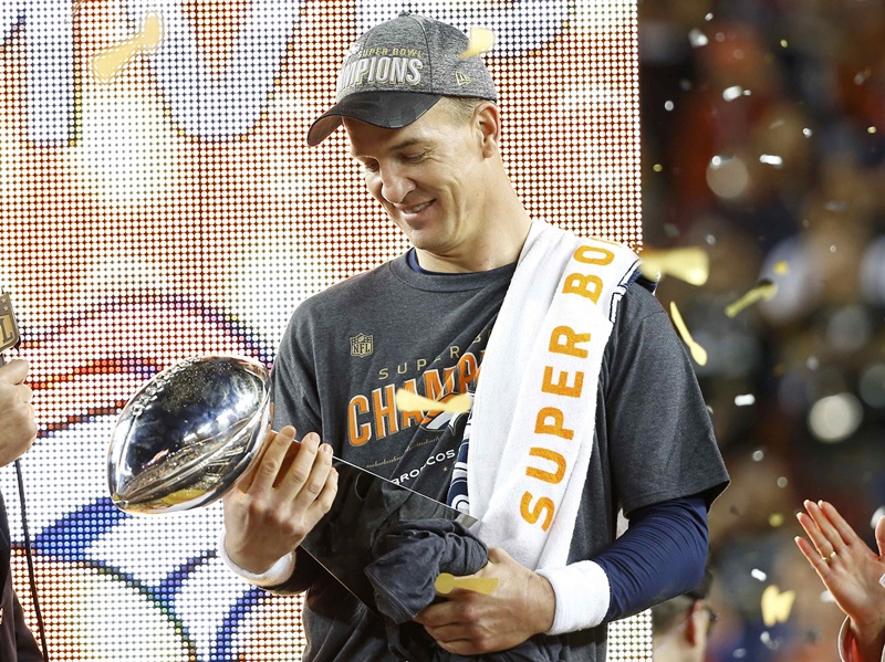 Denver Broncos' quarterback Peyton Manning holds the Vince Lombardi Trophy after the Broncos defeated the Carolina Panthers in the NFL's Super Bowl 50 football game in Santa Clara