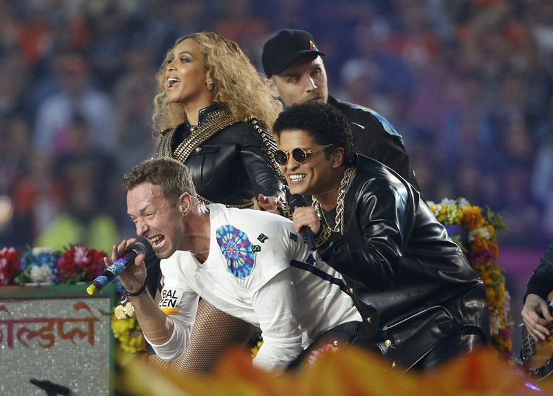 Beyonce, Martin and Mars perform with guitarist Buckland at the half-time show during the NFL's Super Bowl 50 football game between the Carolina Panthers and the Denver Broncos in Santa Clara
