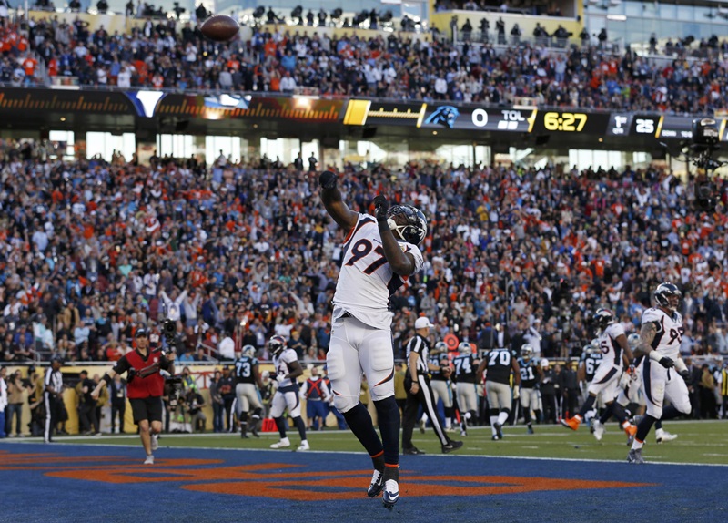 Denver Broncos' Jackson celebrates by throwing the ball into the air after scoring a touchdown on a recovered fumble by Carolina Panthers' quarterback Newton during the first quarter of the NFL's Super Bowl 50 football game in Santa Clara