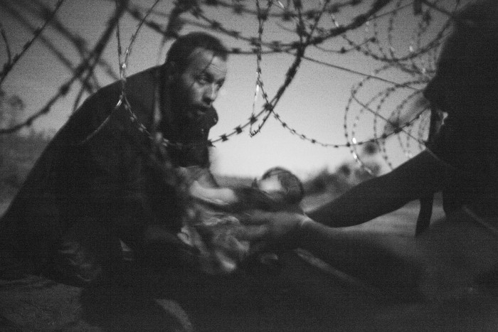 World Press Photo of the Year and Spot News, 1st prize singles Warren Richardson - Hope for a New Life)